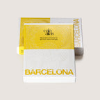 Two Cala Atlas Barcelona Story Deck boxes with embossed details on a yellow and white cover