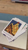Assorted Barcelona Story Deck cards laid out on a table, showing illustrations and reflections