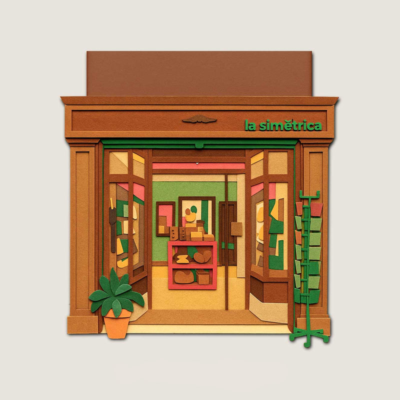 Paper cut illustration of La Simétrica Store with wooden frames, green lettering and handcrafted objects inside